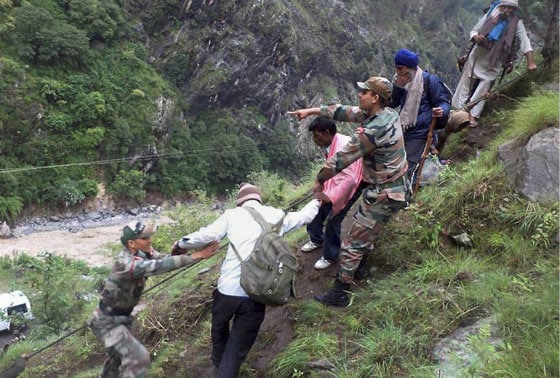 army-personnel-rescue-stranded-pilgrims-to-a-safe-place-in-flood-hit-govind-ghat-in-chamoli-uttarakhand-on-tuesday-floods-triggered-by-torrential-rains-have-stranded-many-people-in-the-state-13716360357963.jpg