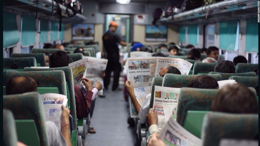 150929131057-reading-newspapers-on-train-india-super-169.jpg