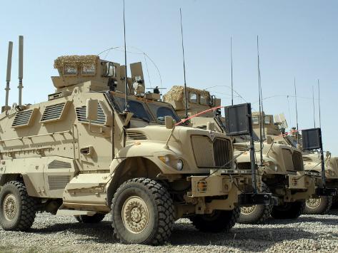 stocktrek-images-mine-resistant-ambush-protected-vehicles-sit-in-the-parking-area-at-joint-base-balad-iraq.jpg
