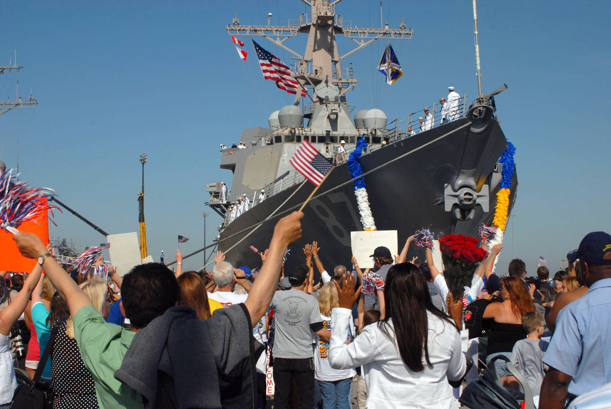 US_Navy_070523-N-7653W-117_Family_and_friends_welcome_home_Sailors_assigned_to_guided-missile_destroyer_USS_Mason_(DDG_87)_as_they_return_to_Naval_Station_Norfolk_after_the_longest_deployment_by_a_carrier_strike_group_since_200.jpg
