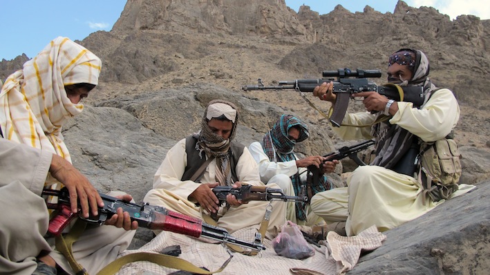 Balochistan-Liberation-Army-commander-Baloch-Khan-checks-his-rifle-among-his-three-escorts-somewhere-in-the-Sarlat-mountains-on-the-Afghan-Pakistani-border-_Karlos-Zurutu.jpg