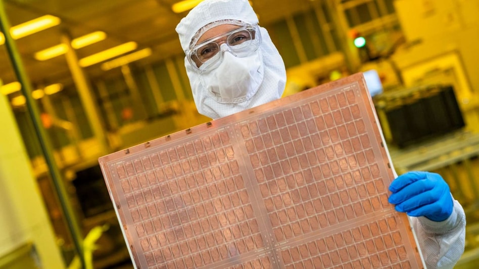 An Intel engineer holds a test glass core substrate (Credit: Intel)