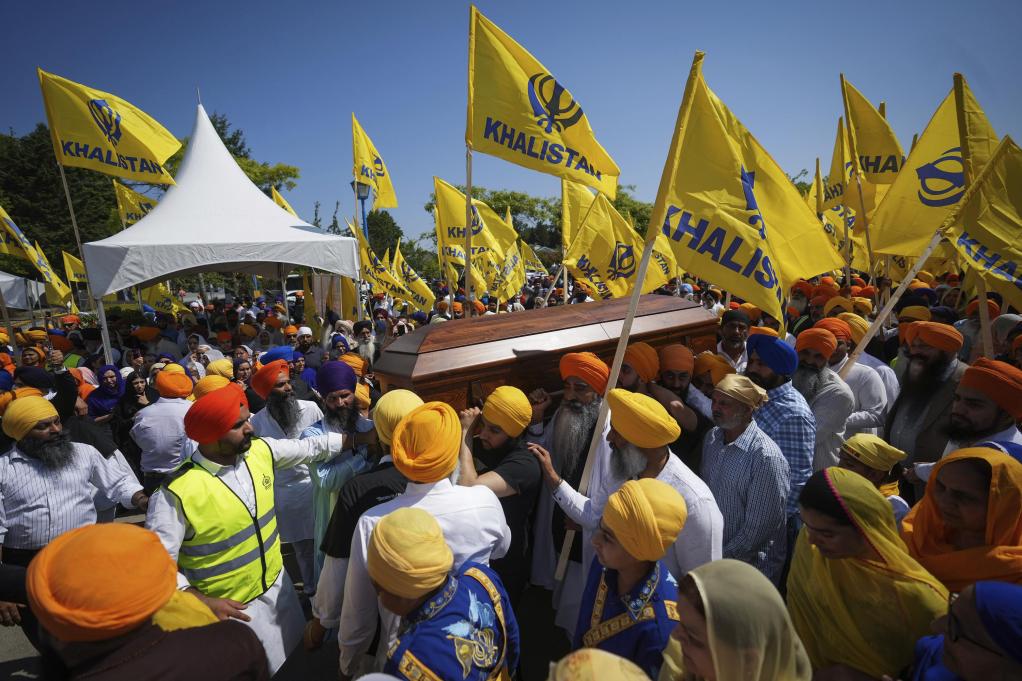 Mourners carry the casket of Hardeep Singh Nijjar at his funeral in June in Surrey, British Columbia. He supported calls for creating a Sikh homeland, Khalistan, in Punjab