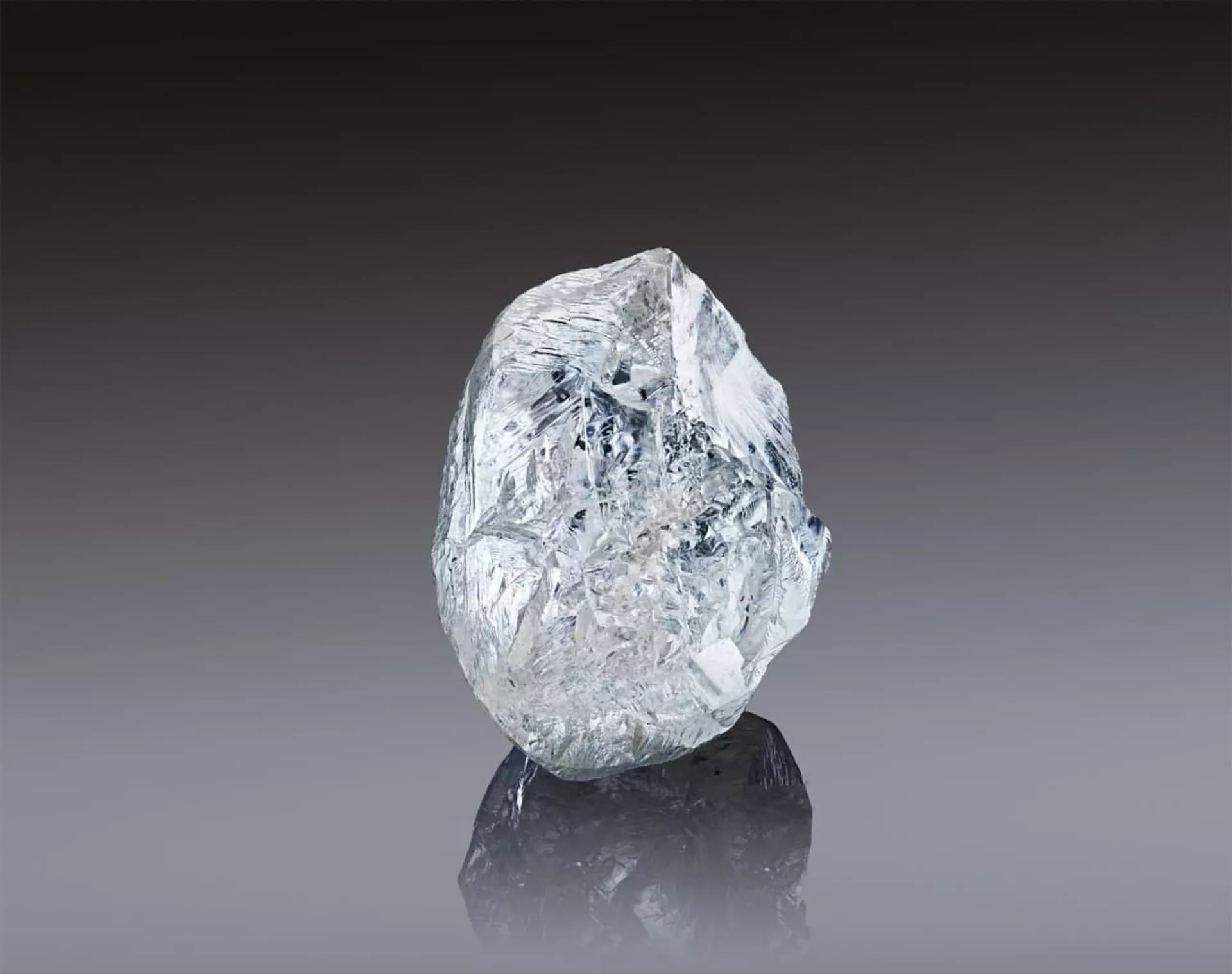 In this handout photo released by the Russian diamond producer Alrosa, a view shows a rare 242-carat rough diamond, which will be offered at the 100th international auction of Alrosa in Dubai on March 22, 2021