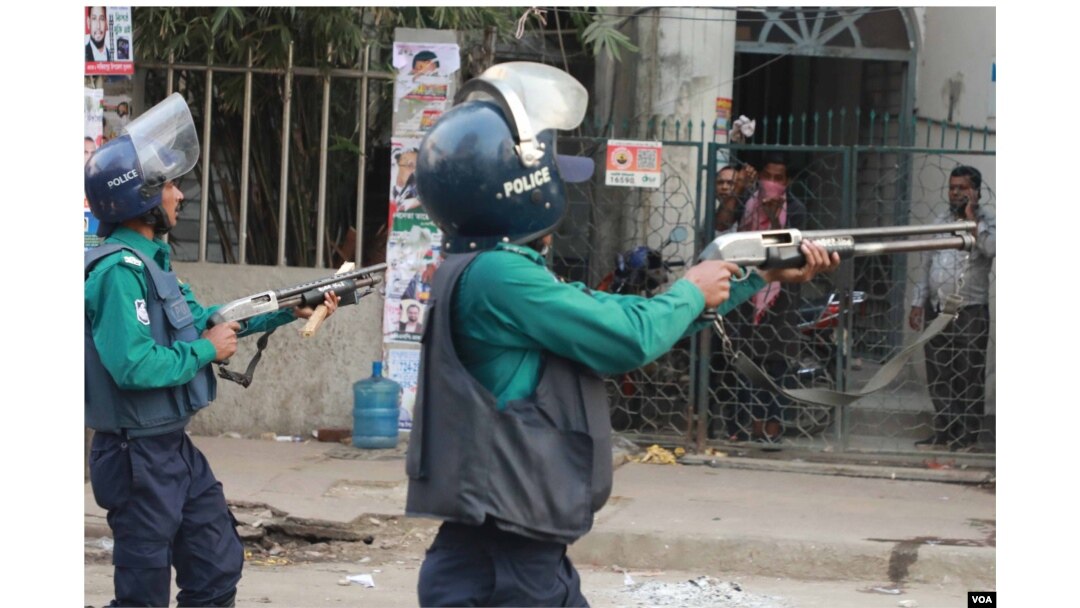 FILE - Policemen firing at opposition BNP activists and supporters in Dhaka, Dec 7, 2022. In the past year, at least 19 opposition rallyists have been killed by the police and armed ruling party activists, according to the BNP. (K M Nazmul Haque/VOA)