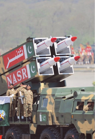 Military personnel stand beside short-range surface-to-surface missile Nasr during the Pakistan Day parade in Islamabad in 2015 | AFP
