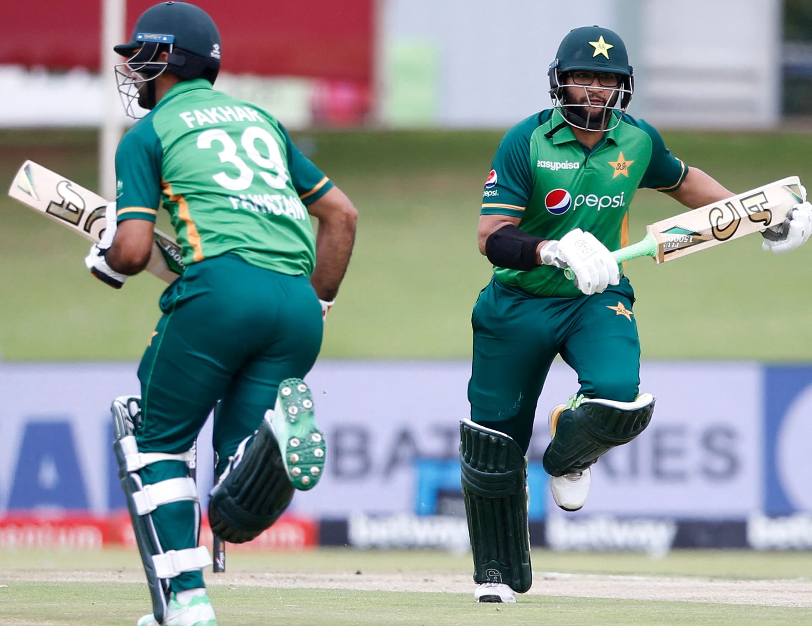 Imamul Haq (R) and Fakhar Zaman run between the wickets during the third ODI. — AFP