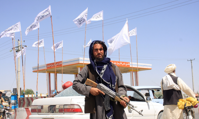 A Taliban fighter looks on as he stands at the city of Ghazni, Afghanistan on Saturday. — Reuters
