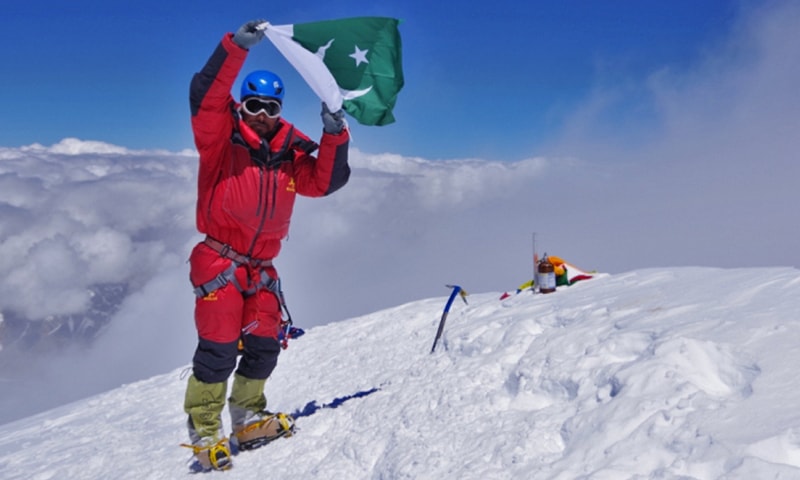 This file photo shows mountaineer Sirbaz Khan raising Pakistan's national flag. — Photo by author/File