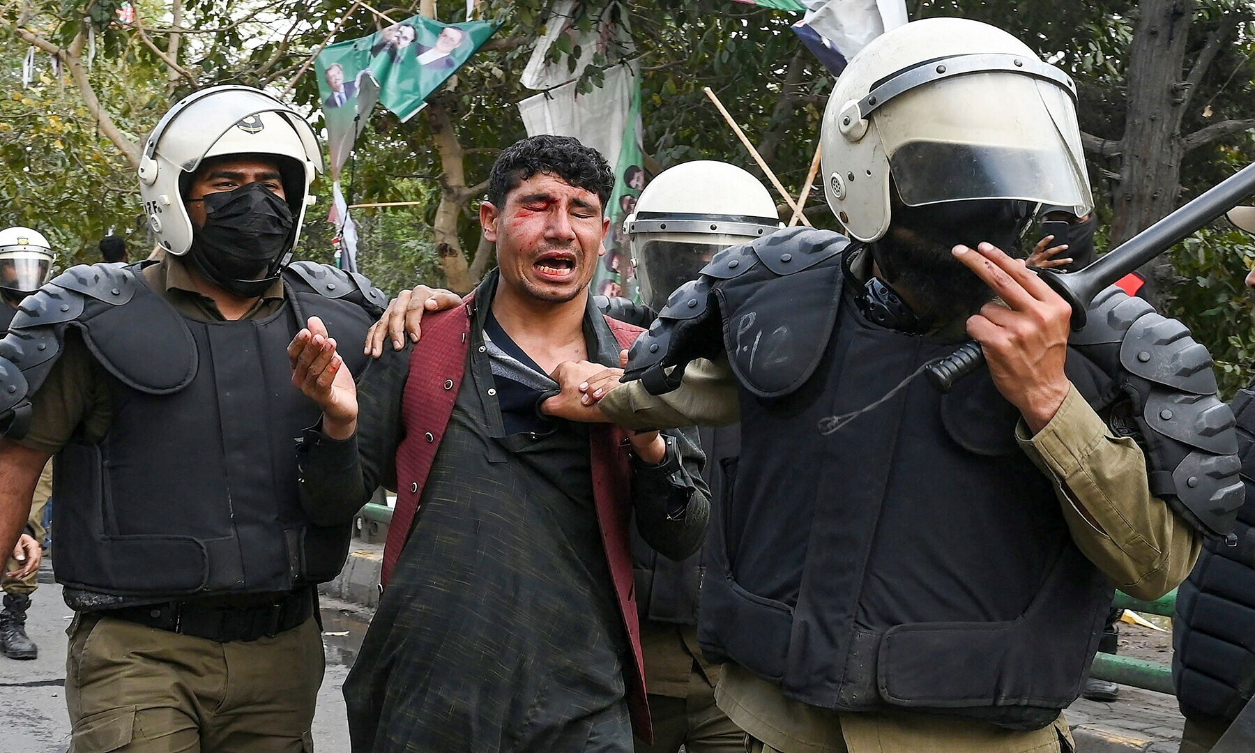 Riot police detain a supporter of Pakistan’s former prime minister Imran Khan, in Lahore on March 18, 2023, whilst Khan was leaving for Islamabad to appear in a court.— Photo by Arif Ali/AFP