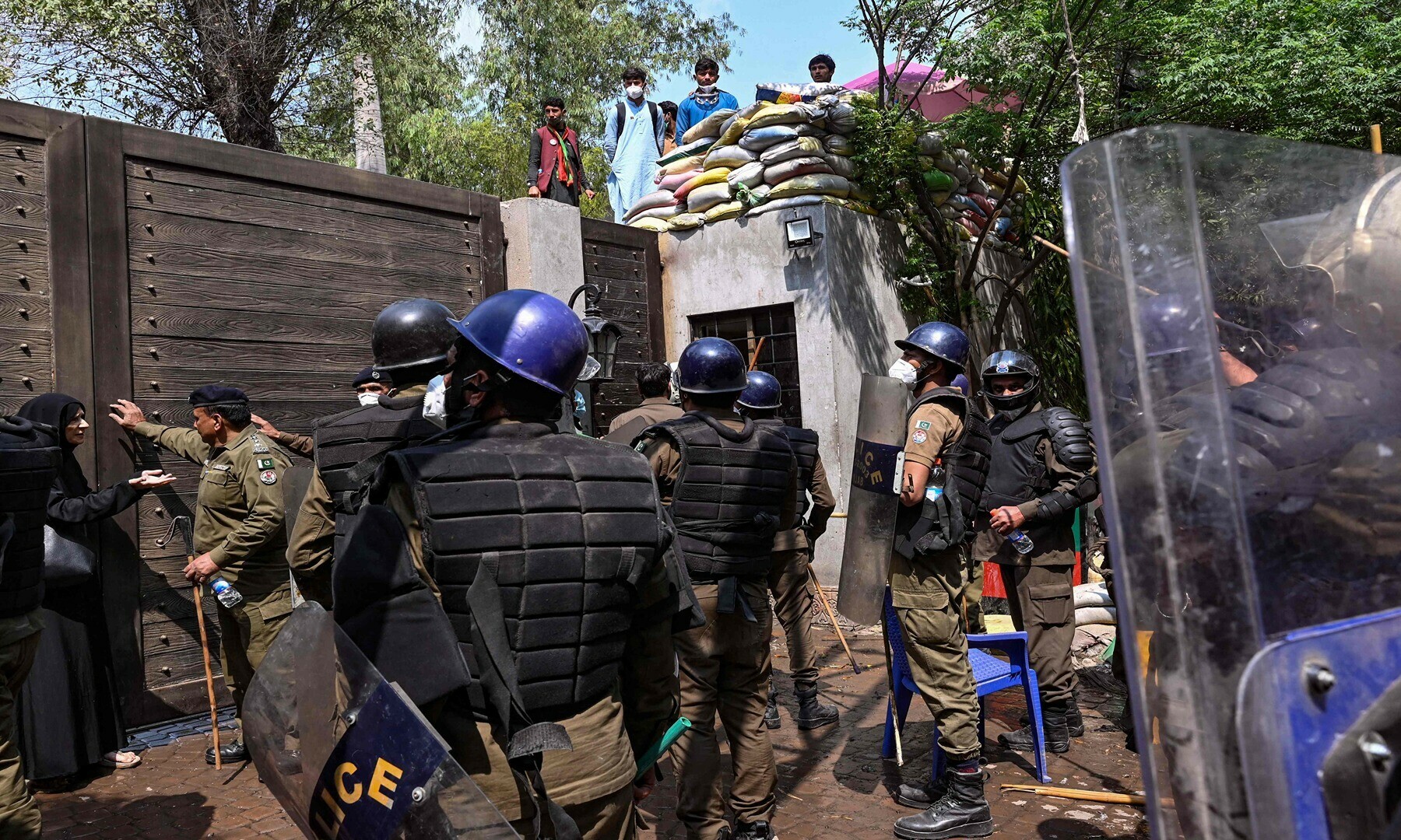 Riot police gather outside the residence of former Pakistan’s prime minister Imran Khan during a raid in Lahore on March 18, 2023, after Khan left for Islamabad to appear in a court.— Photo by Arif Ali/AFP