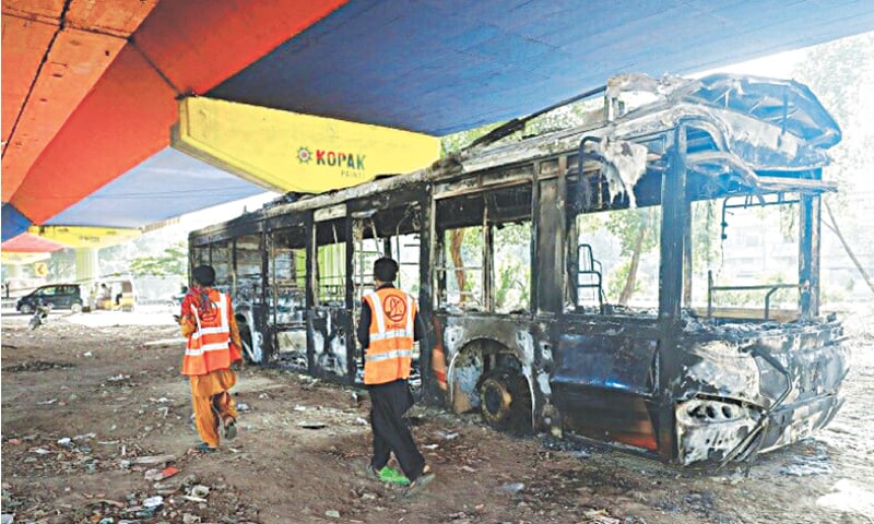  The charred remains of a PBS bus that was set ablaze following Imran Khan’s arrest on May 9, 2023 | Reuters  