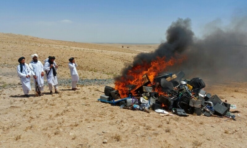 Members of Taliban set fire to a pile of musical instruments and equipment on the outskirts of Herat - Copyright Afghanistan’s Ministry for the Propagation of Virtue and the Prevention of Vice. — AFP