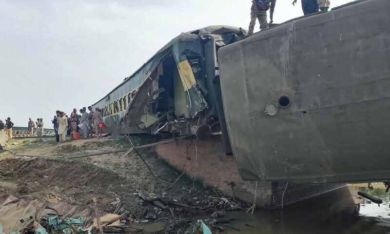 Paramilitary Rangers inspect the carriages at the accident site following the derailment of a passenger train in Nawabshah, on August 6, 2023. — AFP