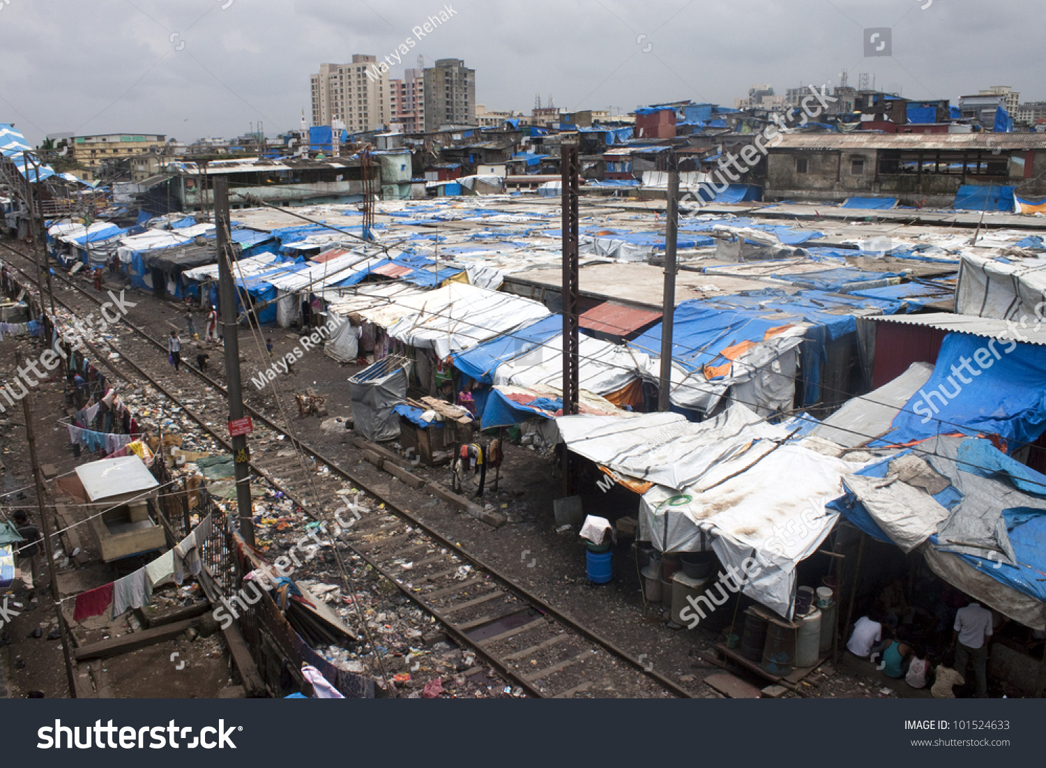 stock-photo-mumbai-august-unidentified-poor-people-living-in-slum-at-august-in-mumbai-india-101524633.jpg