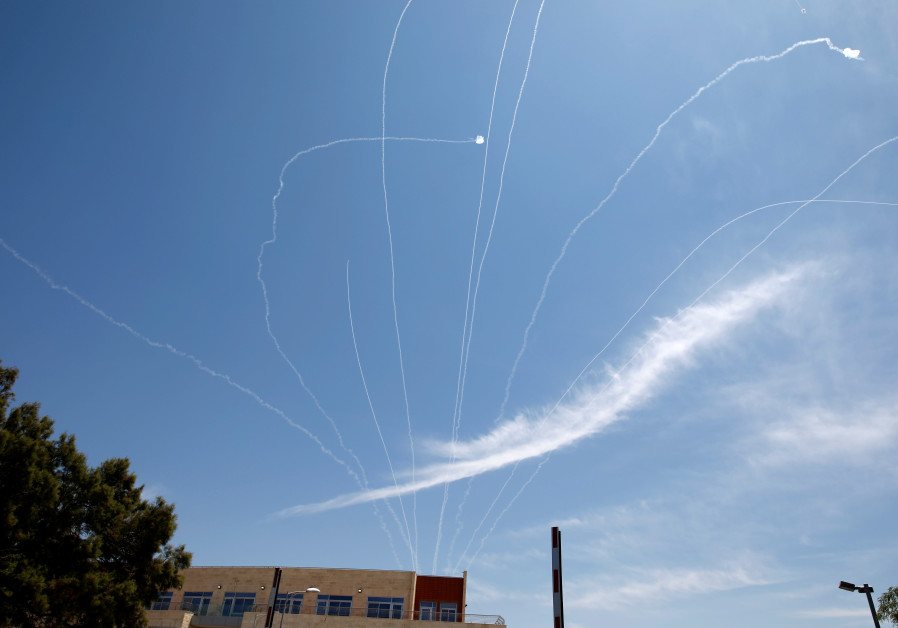 TRAILS ARE seen in the sky as an Iron Dome projectile intercepts a rocket fired from Gaza, above Ashkelon in May 2019. (Photo Credit: AMIR COHEN/REUTERS)