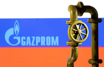 A 3D printed natural gas pipeline is placed in front of displayed Gazprom logo and Russian flag in this illustration taken on 8 February 2022. 