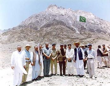 Abdul Qadeer Khan (fifth from left) standing with other military and scientific officials outside the iron-steel tunnel inside the Räs Koh Hills in 1998 just before Pakistan carried out its first public nuclear weapons test there 