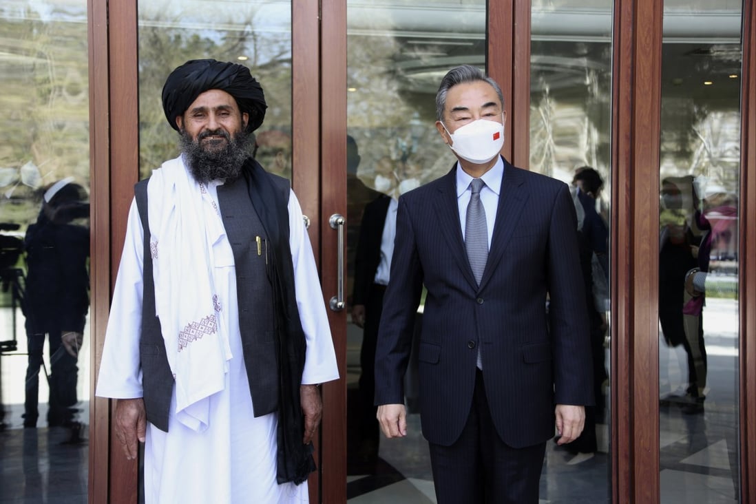 Chinese Foreign Minister Wang Yi, right, stands with Abdul Ghani Baradar, acting deputy prime minister of the Afghan Taliban’s caretaker government, in Kabul on March 24, 2022. Photo: Xinhua