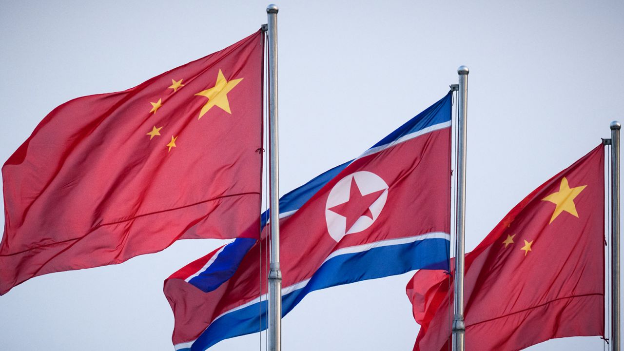 In a photo taken on June 19, 2019, North Korean and Chinese flags fly on Kim Il Sung square in Pyongyang.