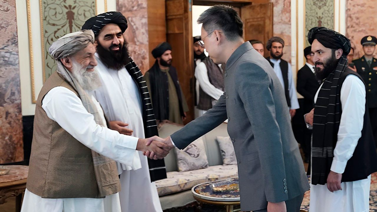 China's new ambassador to Afghanistan Zhao Sheng shakes hands with Taliban Prime Minister Mohammad Hasan Akhund at the Presidential Palace in Kabul on September 13.