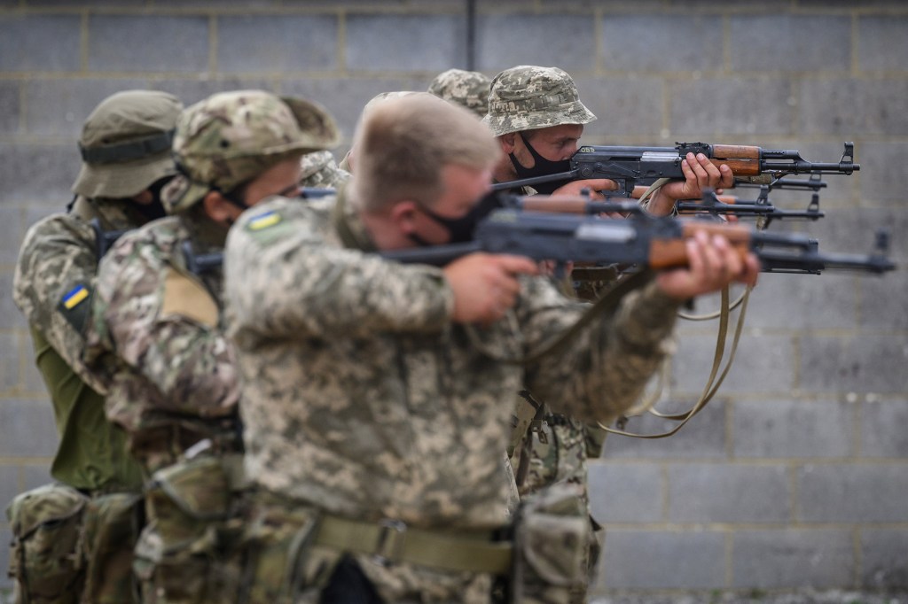 Ukrainian volunteer military recruits take part in a weapon handling exercise whilst being trained by members of the British Armed Forces at a military facility on August 15, 2022 in South East England. Military instructors from Sweden, Denmark, Canada.