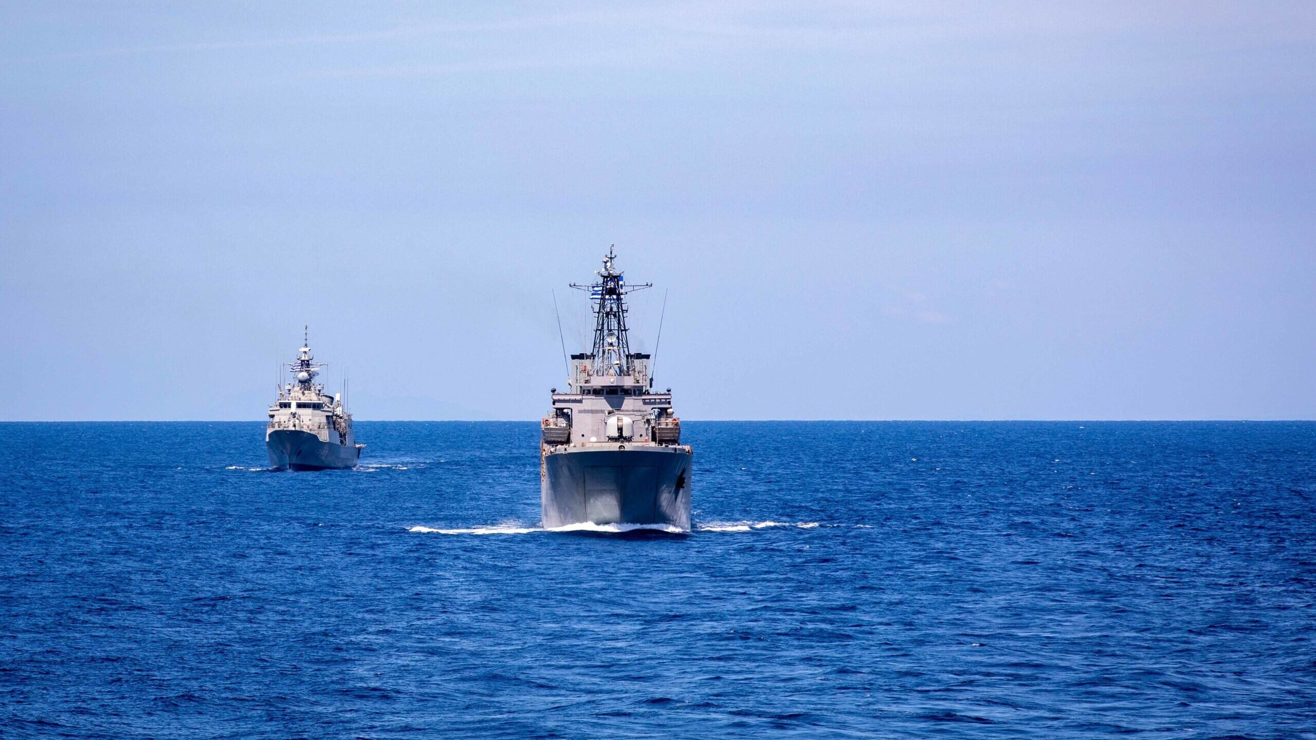 U.S. and Greek (Hellenic) naval ships sail in formation