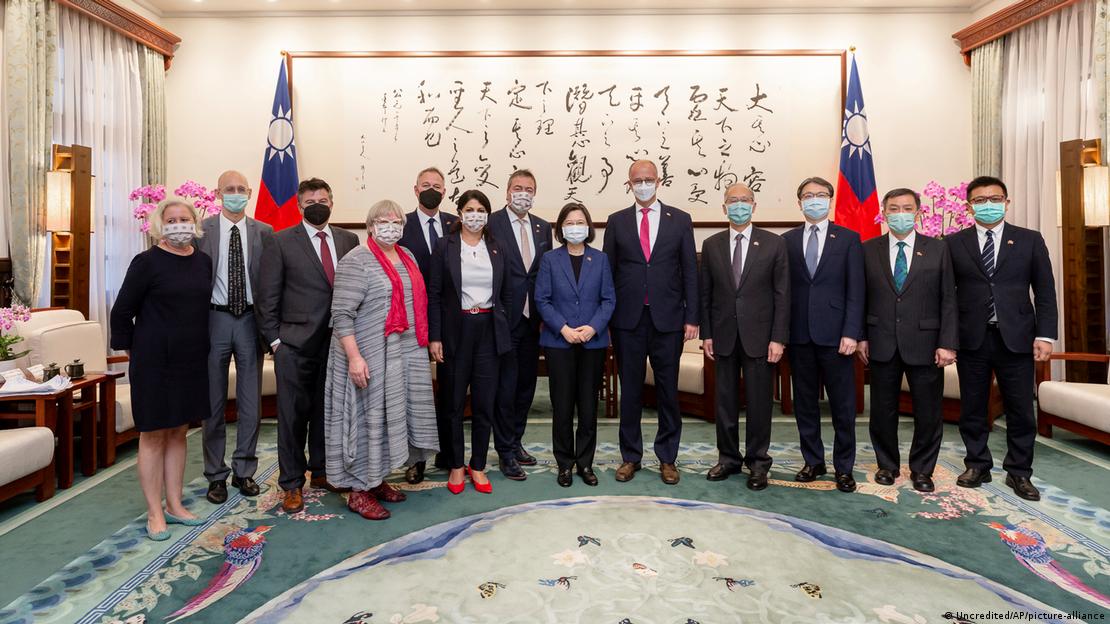 Taiwan's President Tsai Ing-wen, center, poses for photo with a group of German lawmakers led by Free Democratic Party's Peter Heidt, seventh left, at the Presidential Office in Taipei, Taiwan, Monday, Oct. 24, 2022. 