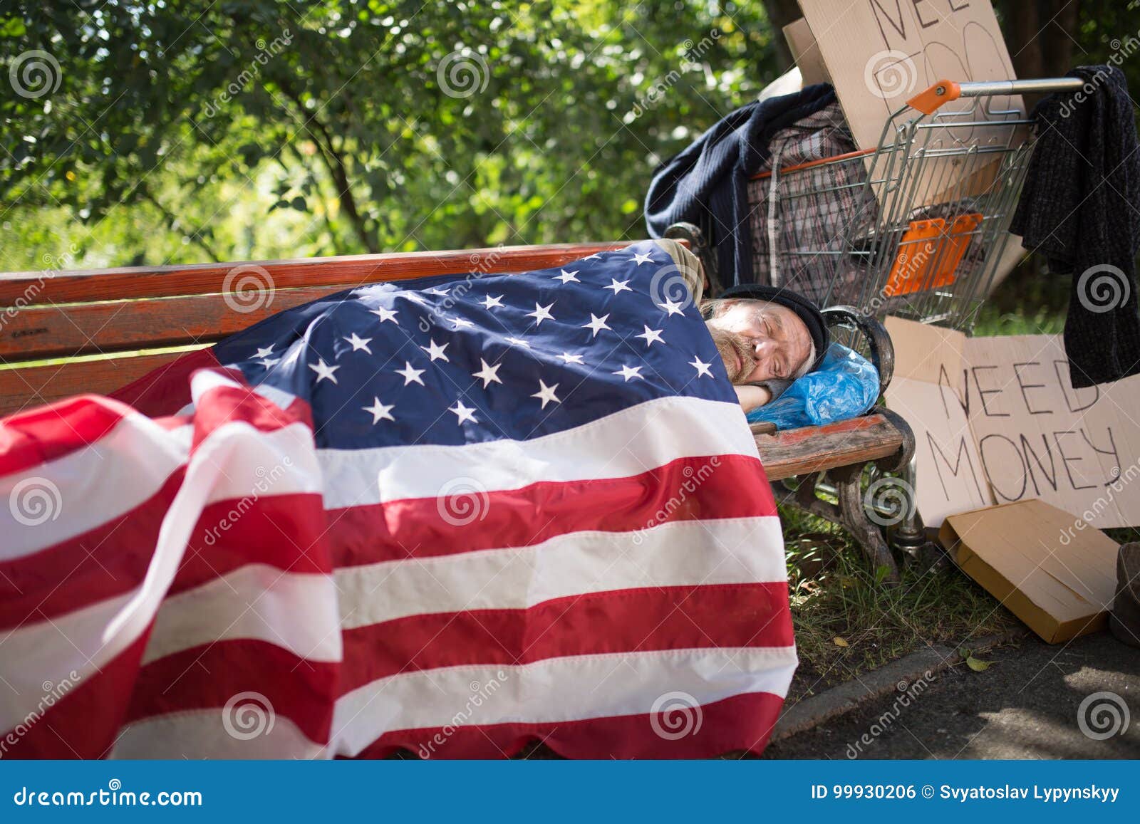 homeless-man-using-usa-flag-as-blanket-homeless-man-using-usa-flag-as-blanket-old-man-no-money-home-living-99930206.jpg