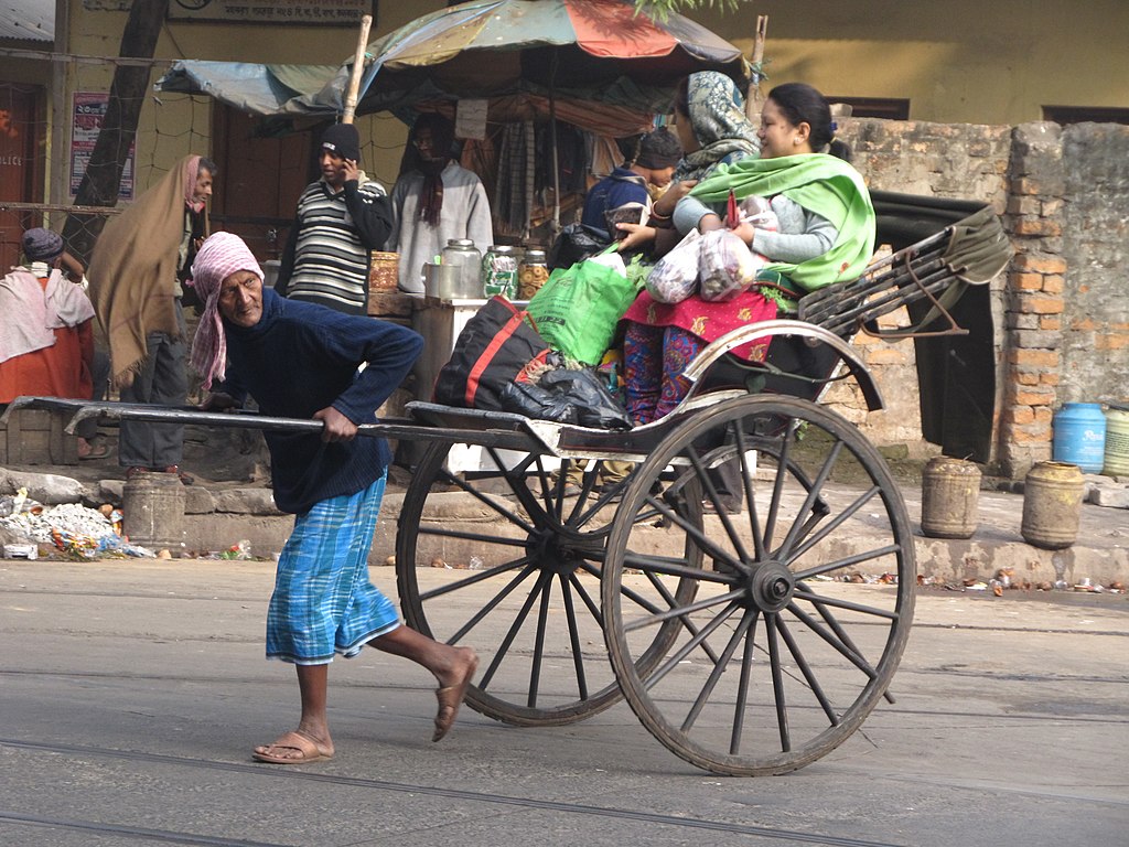 1024px-Hand_Pulled_Rickshaw_-_Dalhousie_Square_South_-_Kolkata_2011-12-18_0134.JPG