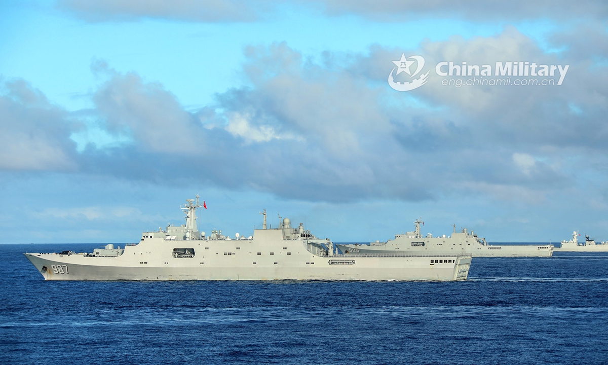 The amphibious dock landing ships Wuzhishan (Hull 987), Kunlunshan (Hull 998) and Changbaishan (Hull 989) attached to a landing ship flotilla with the navy under the PLA Southern Theater Command steam alongside in waters of the South China Sea during a maritime training exercise on November 18, 2020. The exercise lasted four days, focusing on 10 subjects including comprehensive defense, Landing Craft Air Cushion’s (LCAC) transfer, visit, board, search and seizure (VBSS) operation, and live-fire operations. (eng.chinamil.com.cn/Photo by Liu Jian) 