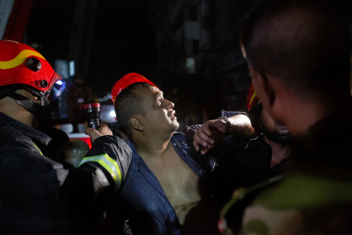A man rescued from the Khawaja Tower where a fire broke out on 26 October 2023. Photo: Nayem Ali / TBS 