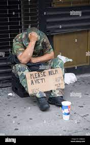 Down and out US Marine Corp veteran begging for monetary help on 6th Ave.  in New York City Stock Photo - Alamy