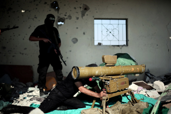 453771696-armed-izz-ad-din-al-qassam-brigades-military-gettyimages[1].jpg
