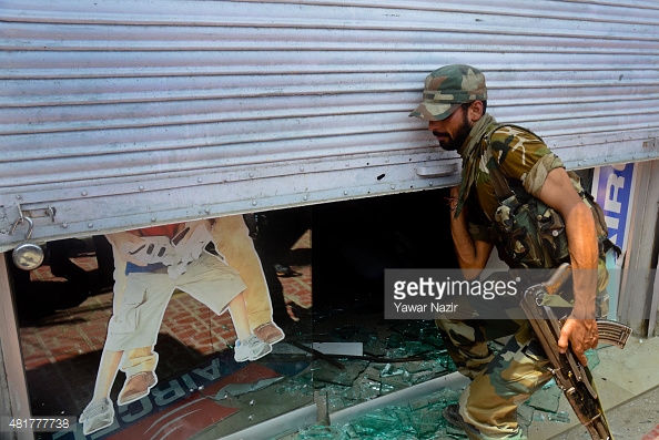 481777738-an-indian-policeman-opens-the-shutter-of-a-gettyimages.jpg