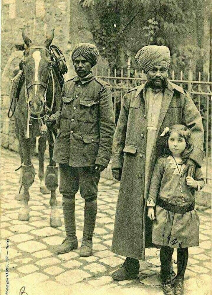 A French girl poses with the Sikh saviours of….jpg