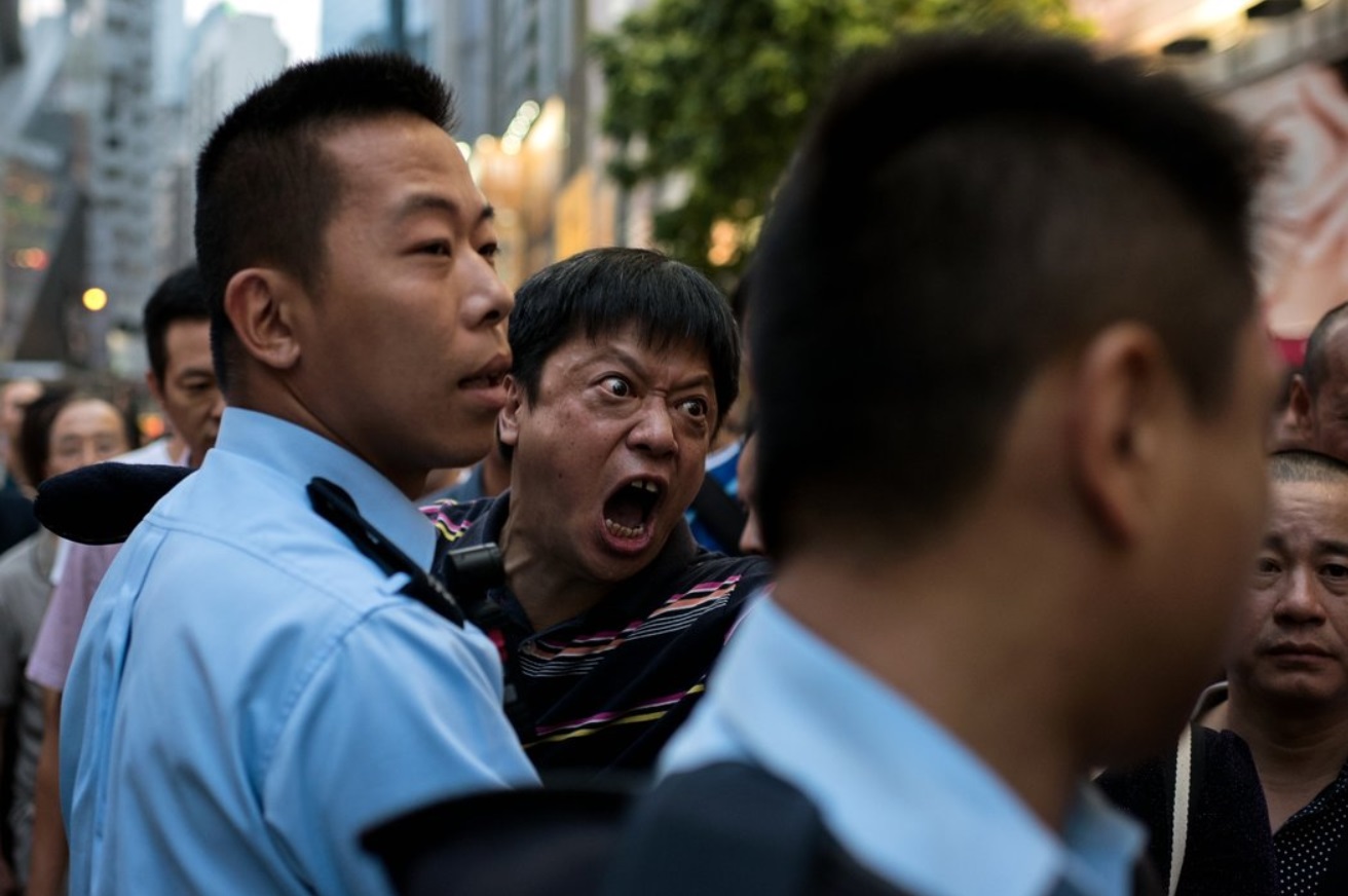 A man screaming at pro-democracy protesters to stop occupying an area of the Causeway Bay.jpg