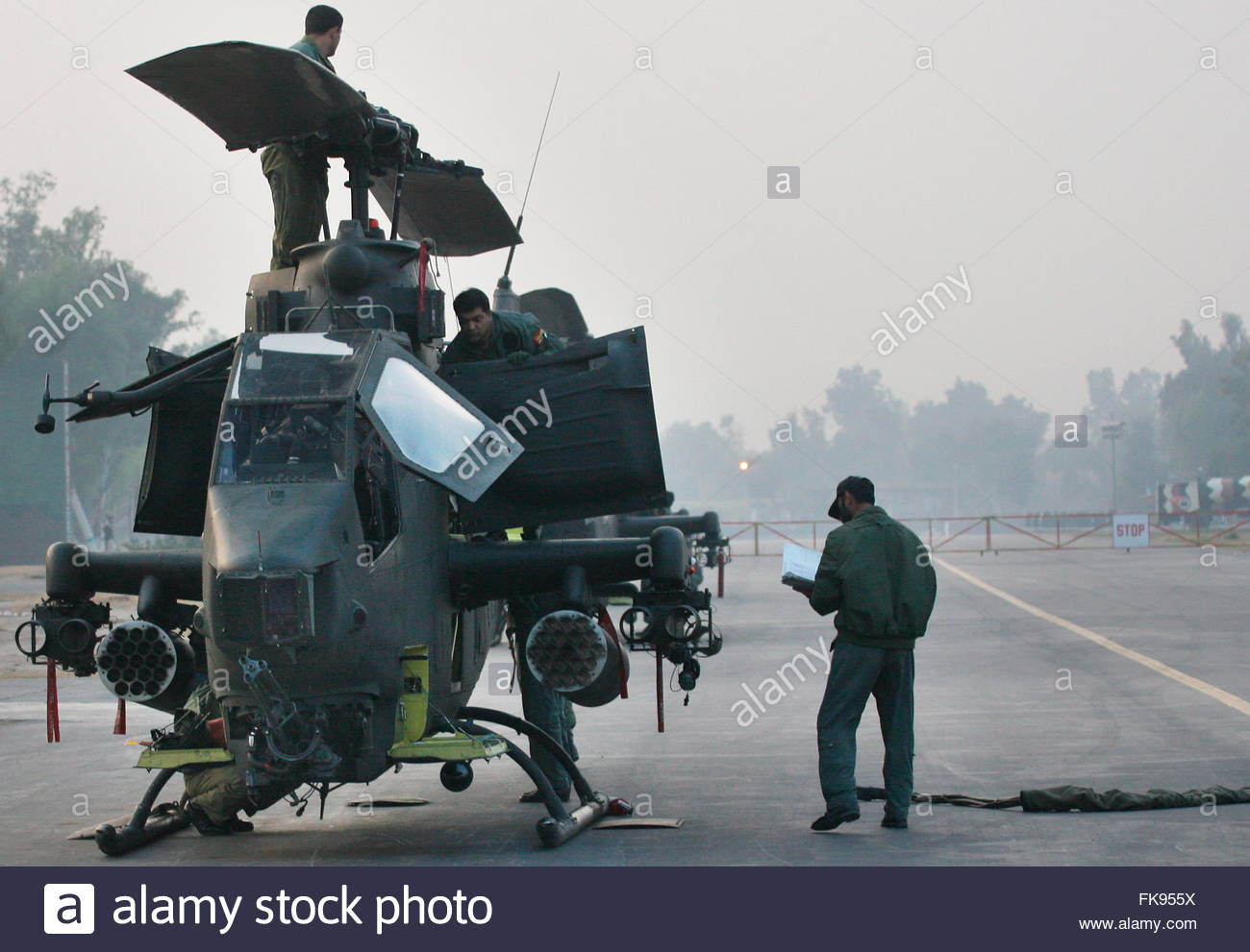 a-pakistan-army-cobra-helicopter-gunship-is-checked-prior-to-participate-FK955X.jpg