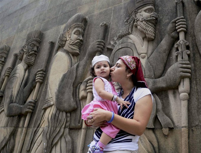 a-parsi-woman-kisses-her-child-on-occasion-of-parsi-new-year-navroz_137690613990.jpg