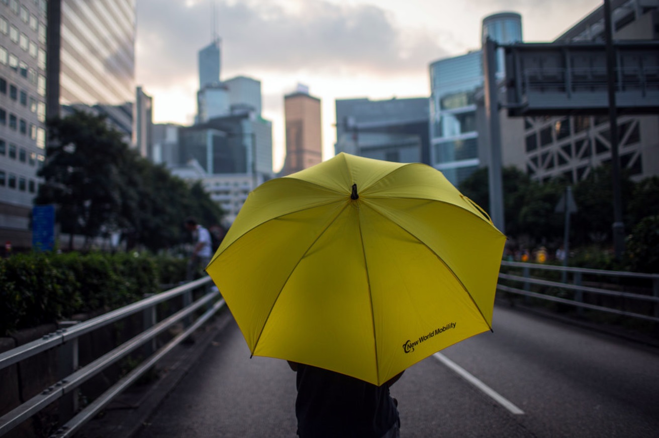 A protester held an umbrella on Wednesday in Hong Kong..jpg