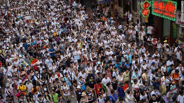 A river of protesters, wearing white T-shirts to show their support for democracy,.jpg