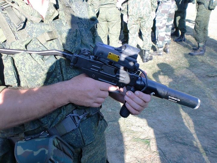 A Russian Soldier Checks Out Silenced MICRO UZI Of PARA SF......jpg