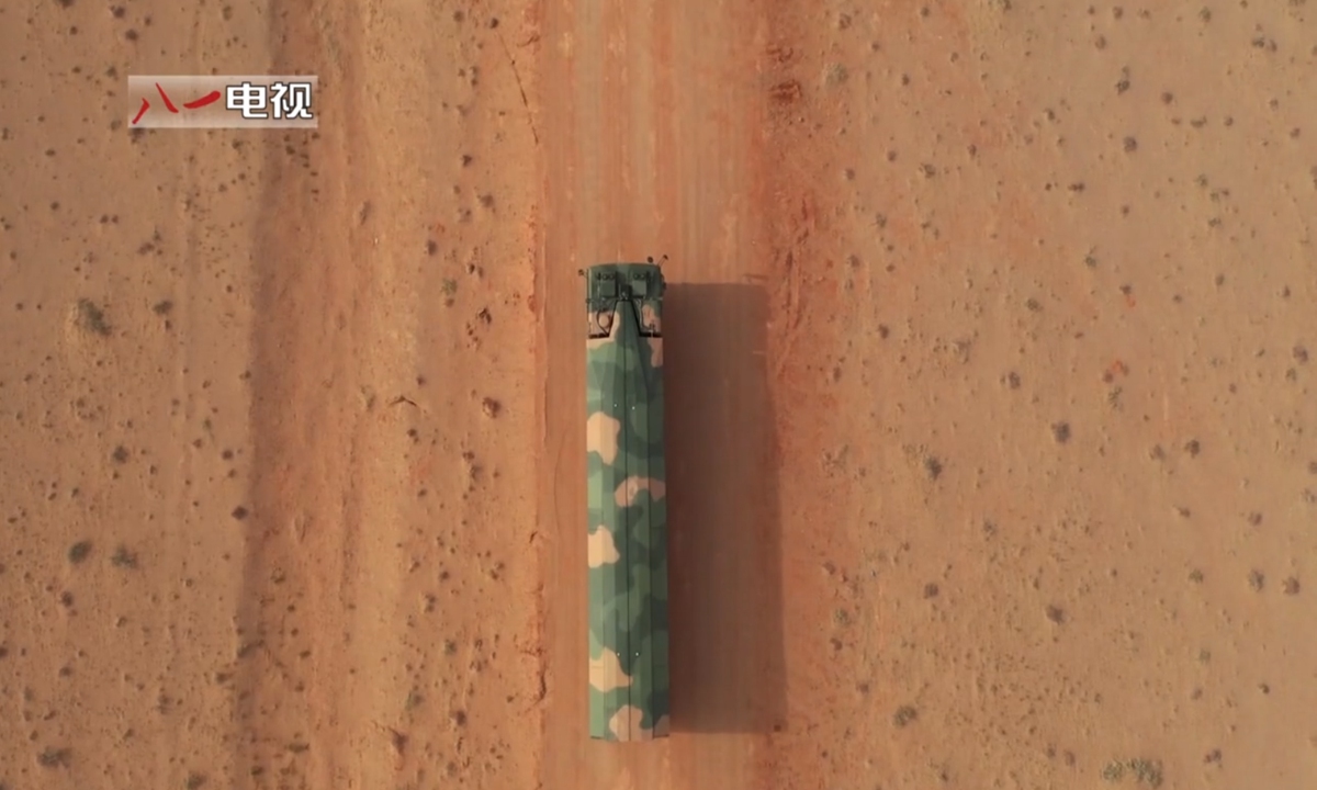 A transporter erector launcher (TEL) of DF-17 missile in a desert - Photo Screenshot from 81....jpeg