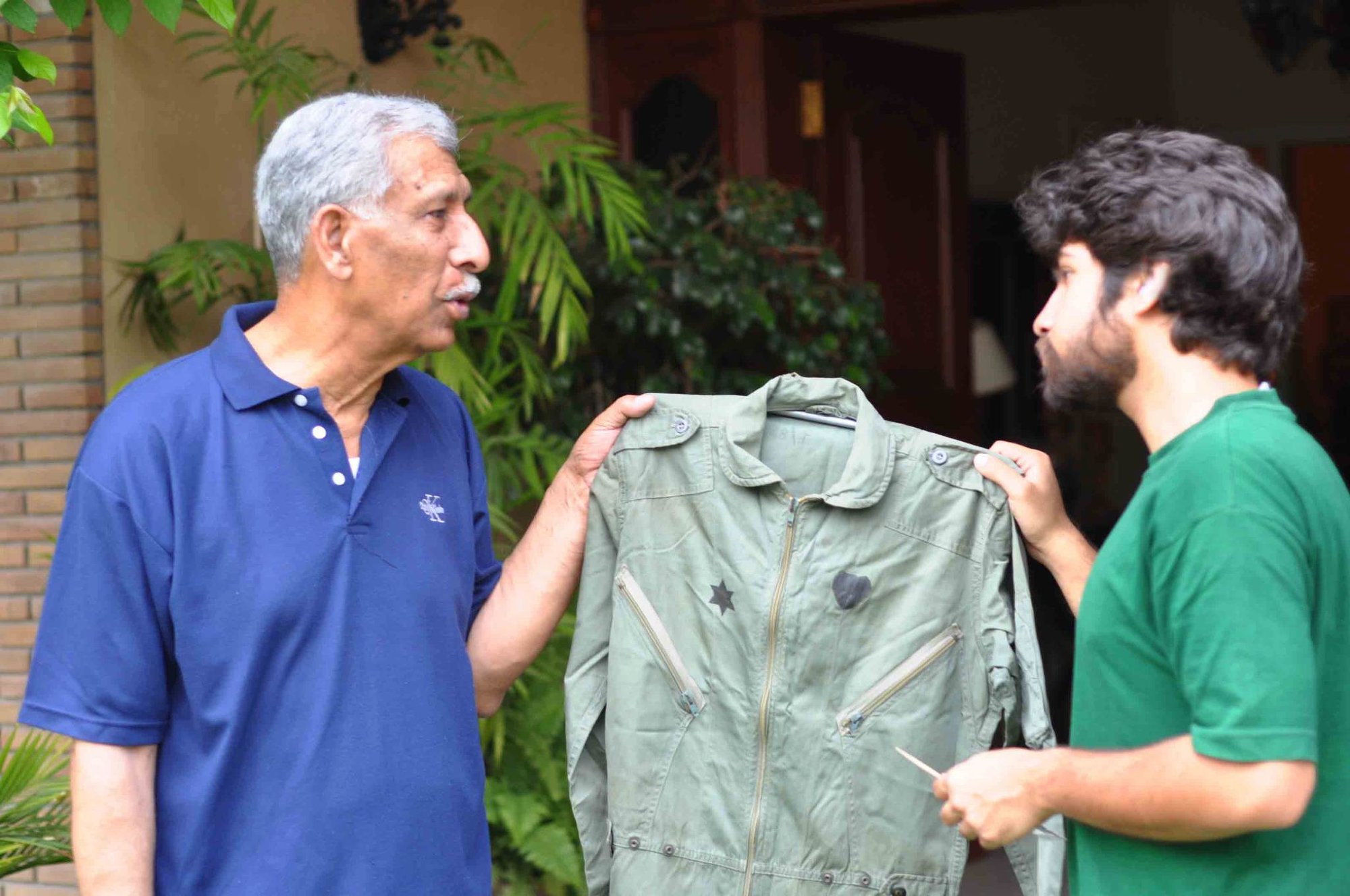 AC Sattar Alvi with flying coverall of Capt M Lutz - IAF Mirage IIICJ Pilot.jpg