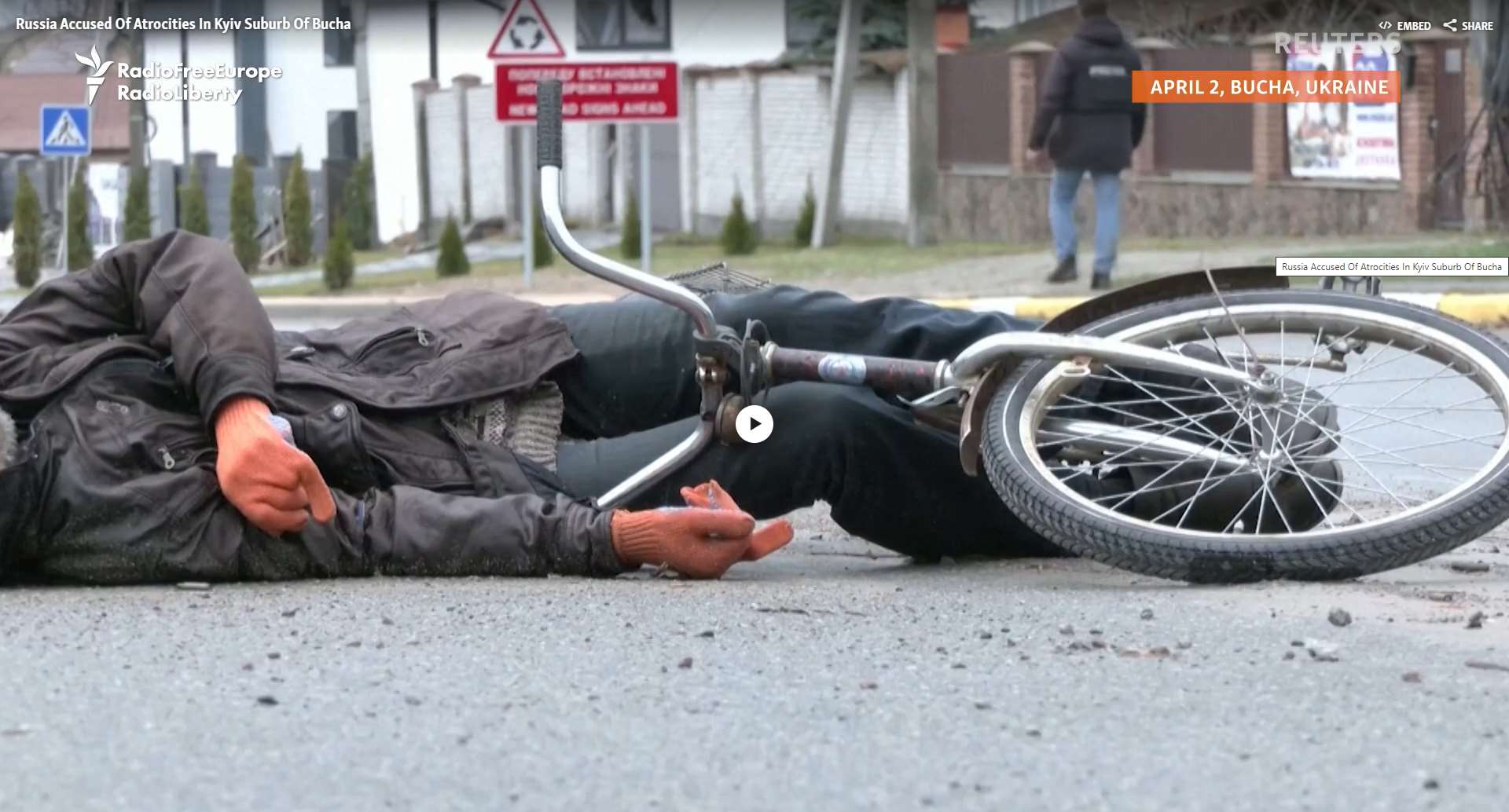 Bucha massacre staged - Man with bicycle - hands covered by gloves.jpg