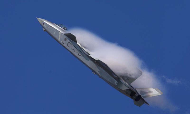 China's J-20 stealth fighter jet displays its new coating of stealth material and flies over ...jpeg