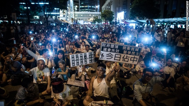 Demonstrators staged a sit-in on Chater Road in Central district after the march.jpg