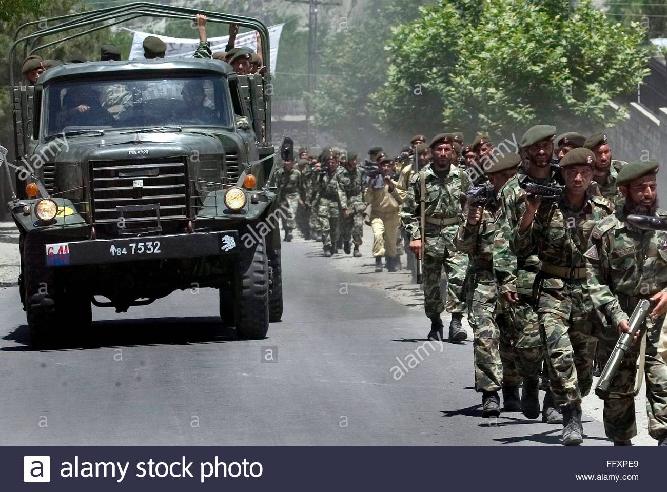 epa000459198-pakistan-army-troops-return-to-the-cantt-area-after-regular-FFXPE9.jpg