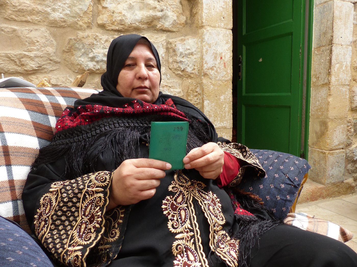 jamila-al-shalaldih-with-her-numbered-id-card-1400x1050.jpg