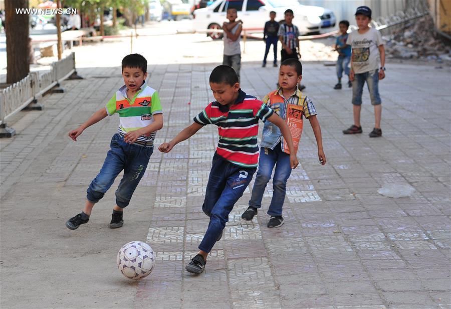 Kashgar,Xinjiang.(8).28May2016,kids-play-soccer.jpg